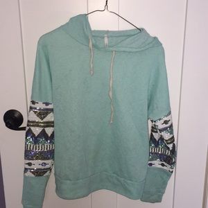 Light blue light sweater with sequence on the side